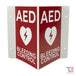 AED And Bleeding Control Transforming Sign With Red Background Front Angle