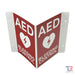 AED And Bleeding Control Transforming Sign With Red Background Top Angle